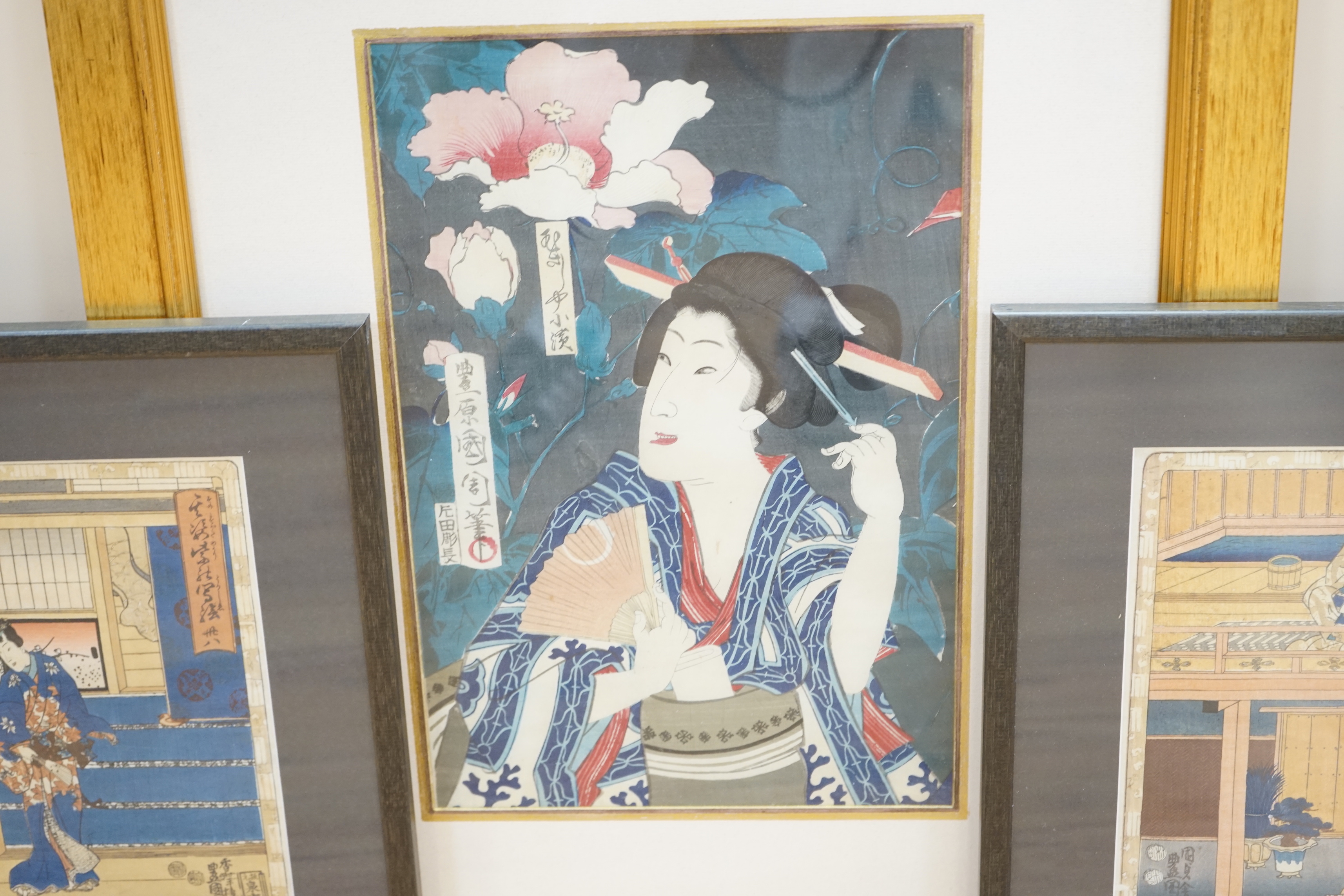 Three Japanese woodblock prints including after Toyohara Kunichika (1835-1900) Lady with flowers, with toshidama seal of the Utagawa School and after Utagawa Kunisada (1786-1865) Gust of wind, largest 35 x 23cm